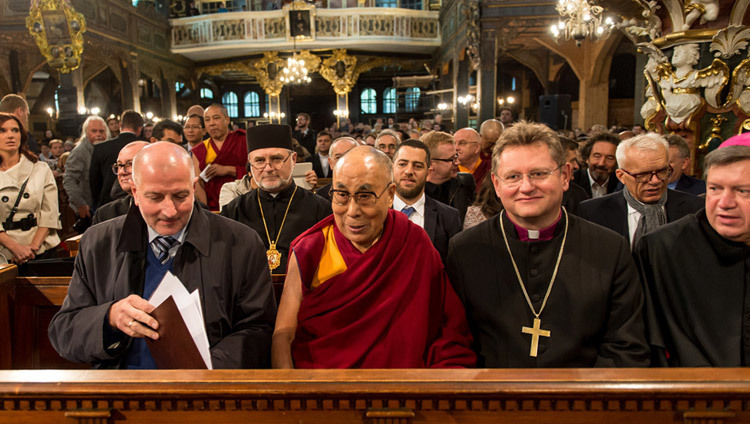 His Holiness the Dalai Lama sitting in the front row of the Church of Peace in Swidnica, Poland on September 21, 2016. Photo/Maciej Kulczynski