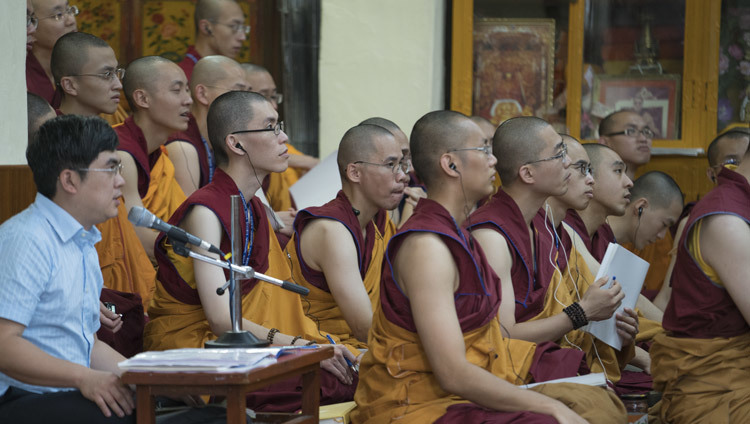 The Chinese language interpreter sitting with some of the more than 1000 people from Taiwan during the first day of His Holiness the Dalai Lama's teachings at the Main Tibetan Temple in Dharamsala, HP, India on October 3, 2106. Photo/Tenzin Choejor/OHHDL