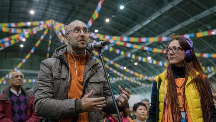 A member of the audience asking His Holiness the Dalai Lama a teaching during the teaching in Riga, Latvia on October 10, 2016. Photo/Tenzin Choejor