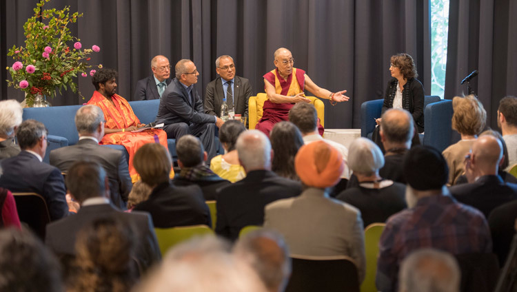 His Holiness the Dalai Lama speaking at an interfaith dialogue at the House of Religions in Bern, Switzerland on October 12, 2016. Photo/Manuel Bauer