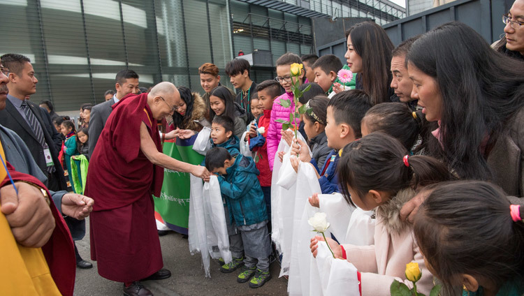 His Holiness the Dalai Lama being welcomed by children as he arrives at the Hallenstadion in Zurich, Switzerland on October 14, 2016. Photo/Manuel Bauer