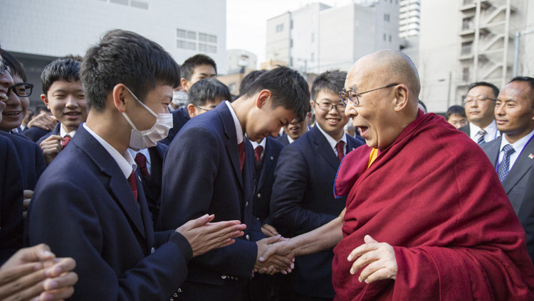 His Holiness the Dalai Lama greeting students on his arrival at Seifu High School in Osaka, Japan on November 10, 2016. Photo/Jigme Choephel