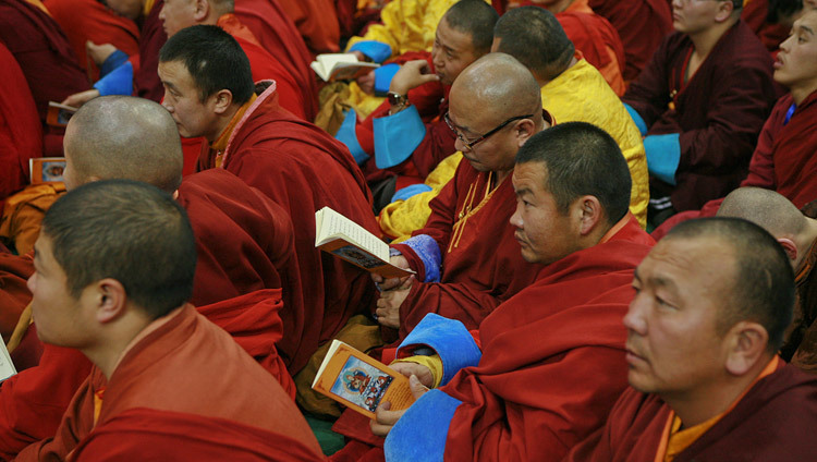 Members of the audience following the text during the afternoon session His Holiness the Dalai Lama's teaching in Ulaanbaatar, Mongolia on November 20, 2016. Photo/Igor Yanchoglov