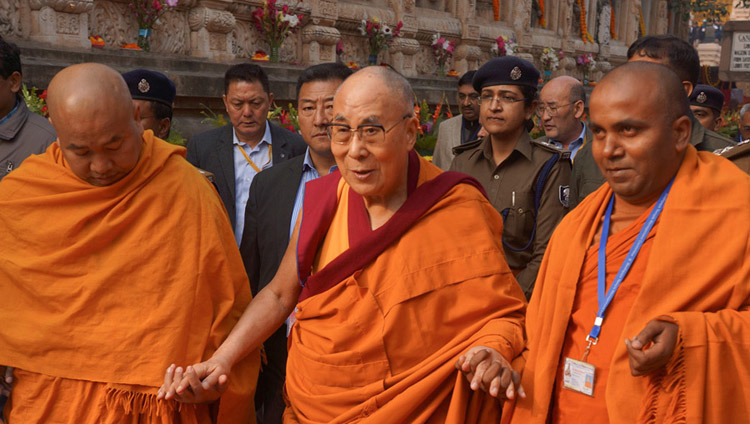 Two monks from the Mahabodhi Society escorting His Holiness the Dalai Lama around the Mahabodhi Temple in Bodhgaya, Bihar, India on December 29, 2016. Photo/Jeremy Russell/OHHDL