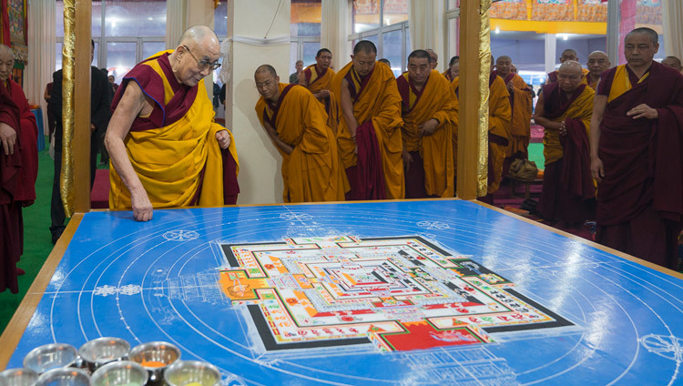 His Holiness the Dalai Lama inspecting the work on the sand mandala as after the morning's Kalachakra preparatory rituals in Bodhgaya, Bihar, India on January 6, 2017. Photo/Tenzin Choejor/OHHDL