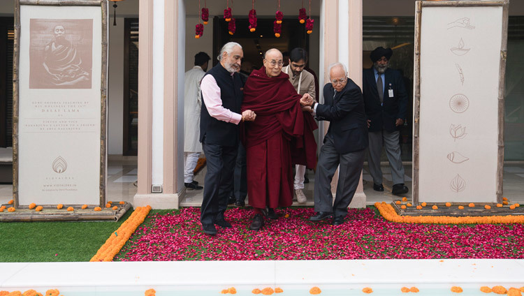 His Holiness the Dalai Lama being escorted to the dais to give the inaugural Vidyaloke teachings in New Delhi, India on February 3, 2017. Photo/Tenzin Choejor/OHHDL