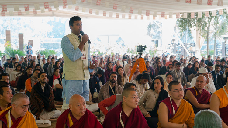 A member of the audience asking His Holiness the Dalai Lama a question during his teaching in New Delhi, India on February 3, 2017. Photo/Tenzin Choejor/OHHDL