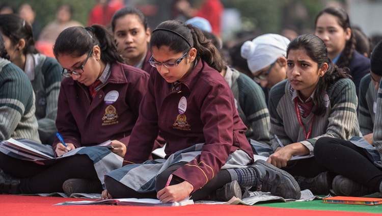 Some of the over 1300 students from 80 schools taking notes during His Holiness the Dalai Lama's talk at the Convent of Jesus and Mary in New Delhi, India on February 6, 2017. Photo/Tenzin Choejor/OHHDL