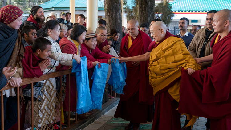 His Holiness the Dalai Lama greeting members of the public on his way to the Main Tibetan Temple on the second day of teachings in Dharamsala, HP, India on March 14, 2017. Photo by Tenzin Choejor/OHHDL