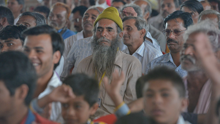 Members of the gathering listening to His Holiness the Dalai Lama speaking at Narmade-Sewa Yatra in Turnal, Madhya Pradesh, India on March 19, 2017. Photo by Lobsang Tsering/OHHDL