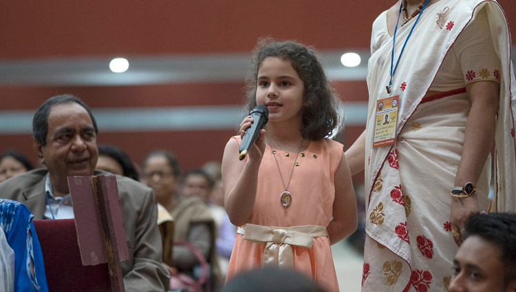 A young member of the audience asking His Holiness the Dalai Lama a question during his talk at Guwahati University Auditorium in Guwahati, Assam, India on April 2, 2017. Photo by Tenzin Choejor/OHHDL