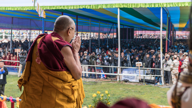 His Holiness the Dalai Lama saluting the crowd of 15,000 on his arrival at Buddha Park in Bomdila, AP, India on April 5, 2017. Photo by Tenzin Choejor/OHHDL