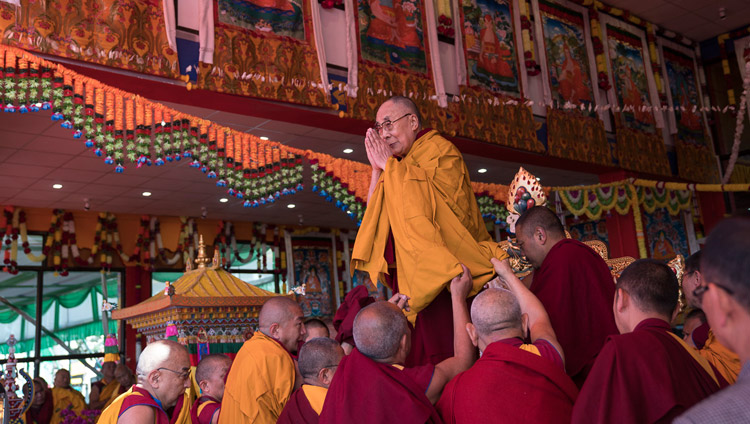 His Holiness the Dalai Lama acknowledging the crowd of over 50,000 gathered to attend the final day of his teachings at the Yiga Choezin teaching ground in Tawang, Arunachal Pradesh, India on April 10, 2017. Photo by Tenzin Choejor/OHHDL