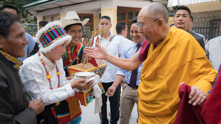 Young Tibetans offering a traditional welcome to His Holiness the Dalai Lama on his arrival at the courtyard of the Main Tibetan Temple on the first day of his three day teaching for Tibetan youth in Dharamsala, HP, India on June 5, 2017. Photo by Tenzin Choejor/OHHDL