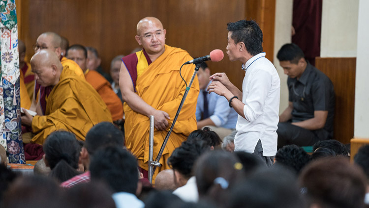 A young Tibetan asking His Holiness the Dalai Lama a question during the first day of teachings from Tibetan youth at the Main Tibetan Temple in Dharamsala, HP, India on June 5, 2017. Photo by Tenzin Choejor/OHHDL