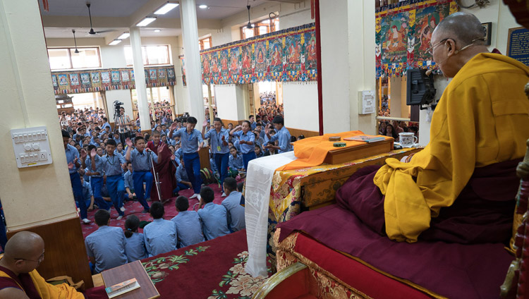 His Holiness the Dalai Lama looks on as young students engage in Buddhist philosophical debate during the second day of his teaching for Tibetan youth at the Main Tibetan Temple in Dharamsala, HP, India on June 6, 2017. Photo by Tenzin Choejor/OHHDL