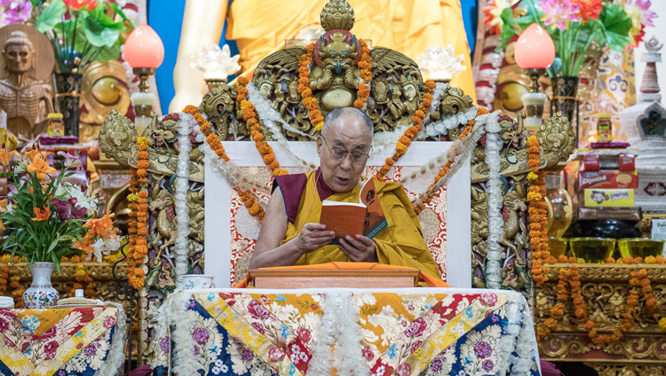 His Holiness the Dalai Lama reading from the text during the final day of his three day teaching for Tibetan youth at the Main Tibetan Temple in Dharamsala, HP, India on June 7, 2017. Photo by Tenzin Choejor/OHHDL