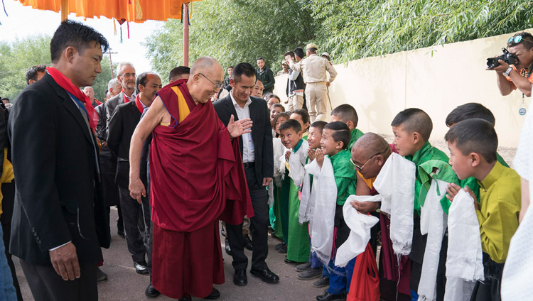 His Holiness the Dalai Lama greeting young students on his way to the Shiwatsel teaching ground in Leh, Ladakh, J&K, India on July 6, 2017. Photo by Tenzin Choejor/OHHDL His Holiness the Dalai Lama greeting young students on his way to the Shiwatsel teaching ground in Leh, Ladakh, J&K, India on July 6, 2017. Photo by Tenzin Choejor/OHHDL