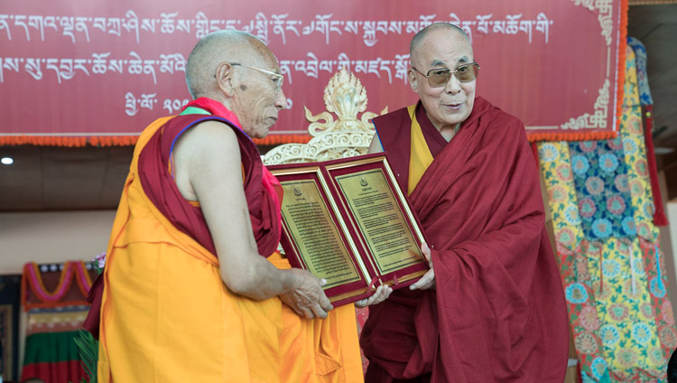 His Holiness the Dalai Lama presenting a certificate of appreciation from the people of Nubra to Ven Thiksey Rinpoche during the closing ceremony of the Great Summer Debate at the teaching ground in Disket, Nubra Valley, J&K, India on July 10, 2017. Photo by Tenzin Choejor/OHHDL