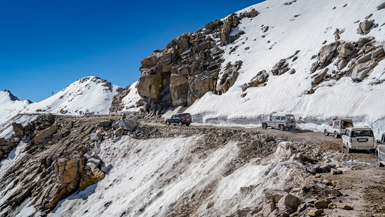 His Holiness the Dalai Lama's motorcade nearing the top of Khardungla Pass in Ladakh, J&K, India on July 15, 2017, which at 18,380 feet / 5,359 meters is the highest motorable pass in the world. Photo by Tenzin Choejor/OHHDL