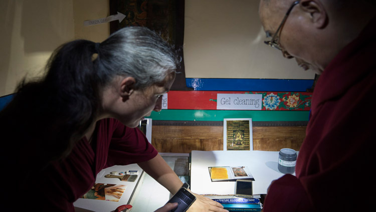 A member of a restoration team explaining to His Holiness the Dalai Lama some of the methods used to restore old Tibetan thangkas during his visit to Matho Monastery in Leh, Ladakh, J&K, India on July 20, 2017. Photo by Tenzin Choejor/OHHDL