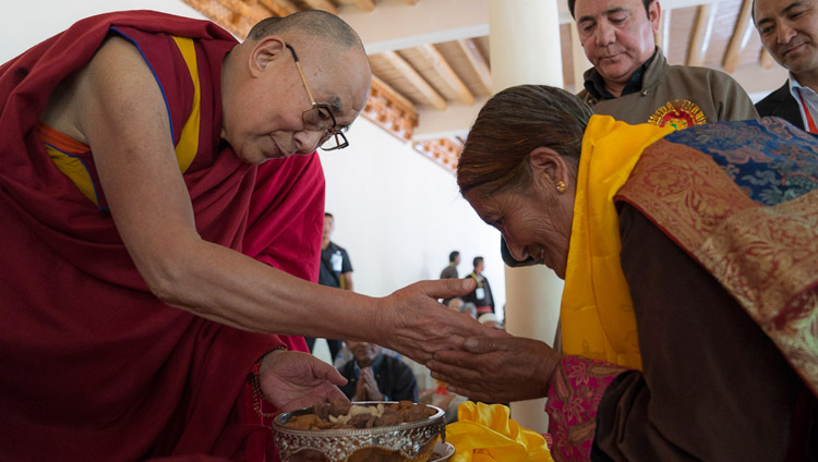 His Holiness the Dalai Lam presenting a gift to a Buddhist supporter of the Muslim community during his visit to Id-Gah in Leh, Ladakh, J&K, India on July 26, 2017. Photo by Tenzin Choejor/OHHDL