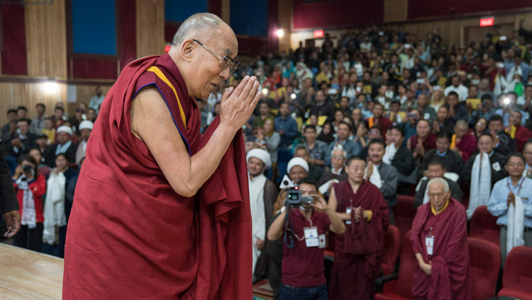 His Holiness the Dalai Lama greeting the audience as he arrives on stage at the start of the Seminar on Communal Harmony at the Central Institute of Buddhist Studies in Leh, Ladakh, J&K, India on July 27, 2017. Photo by Tenzin Choejor/OHHDL