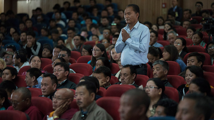 A member of the audience stands as his question is read to His Holiness the Dalai Lama during he Seminar on Communal Harmony in Leh, Ladakh, J&K, India on July 27, 2017. Photo by Tenzin Choejor/OHHDL