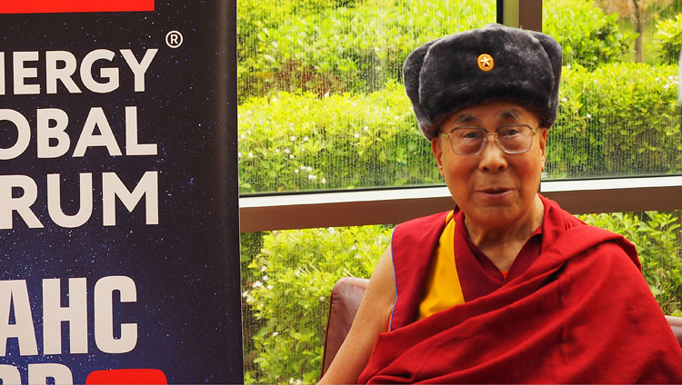 His Holiness the Dalai Lama wearing a soldier's hat presented to him after his interview for Synergy Global Forum in Delhi, India on August 3, 2017. Photo by Jeremy Russell/OHHDL