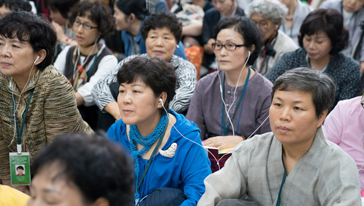 Members of the audienc listening to translations on FM radio during the second day of His Holiness the Dalai Lama's teachings for SE Asians at the Tsuglagkhang in Dharamsala, HP, India on August 30, 2017. PHoto by Ven Lobsang Kunga/OHHDL