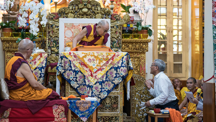 His Holiness the Dalai Lama's English translator reading questions from the audience during the third day of teachings at the Tsuglagkhang in Dharamsala, HP, India on August 31, 2017. Photo by Tenzin Phuntsok/OHHDL