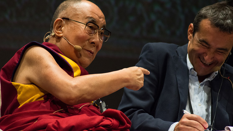 His Holiness the Dalai Lama gesturing at his Italian Translator Fabrizio Pallotti during his talk at he Vittorio Emanuele Theatre in Messina, Sicily, Italy on September 17, 2017. hoto by Federico Vinci/Città Metropolitana di Messina