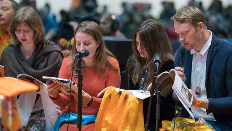 A group of Russina buddhists reciting the Heart Sutra in Russian at the start of His Holiness the Dalai Lama's teaching in Riga, Latvia on September 23, 2017. Photo by Tenzin Choejor