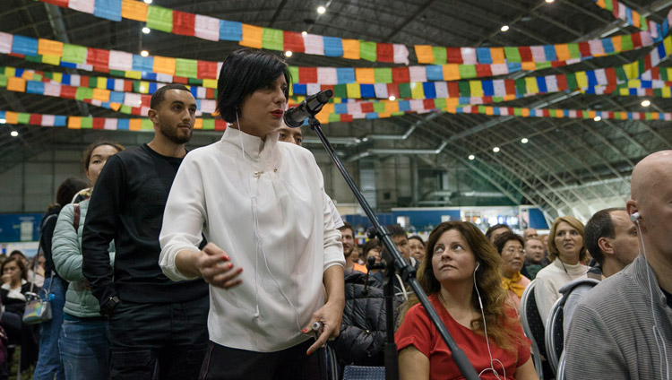 A member of the audience asking His Holiness the Dalai Lama a question during the public dialogue at Skonto Hall in Riga, Latvia on September 25, 2017. Photo by Tenzin Choejor