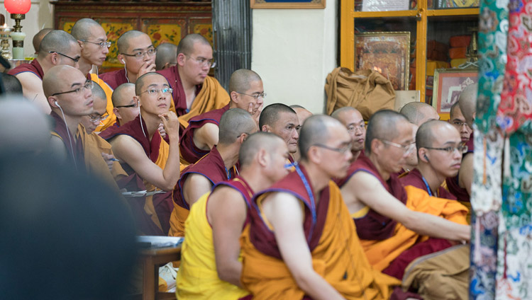 Monastics from Taiwan listening to the Chinese translation on FM radios of His Holiness the Dalai Lama'a teaching at the Tsuglagkhang in Dharamsala, HP, India on October 3, 2017. Photo by Tenzin Choejor