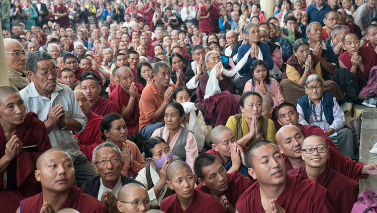 Many of the more the more than 6000 people attending His Holiness the Dalai Lama's second day of teachings waiting in the courtyard to pay their respects as he departs from the Tsuglagkhang in Dharamsala, HP, India on October 4, 2017. Photo by Tenzin Choejor