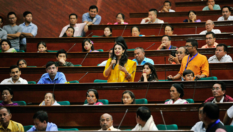 A member of the audience asking His Holiness the Dalai Lama a question during his talk at the City Convention Center hall in Imphal, Manipur, India on October 18, 2017. Photo by Lobsang Tsering A member of the audience asking His Holiness the Dalai Lama a question during his talk at the City Convention Center hall in Imphal, Manipur, India on October 18, 2017. Photo by Lobsang Tsering