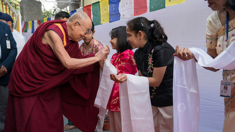 His Holiness the Dalai Lama greeting students on his arrival at Salwan Public School in Delhi, India on November 18, 2017. Photo by Tenzin Choejor