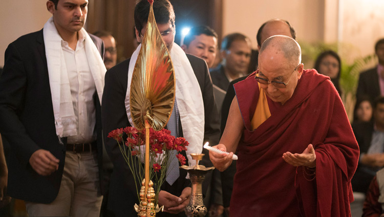 His Holiness the Dalai Lama lighting an lamp to open his talk to members of the Indian Chamber of Commerce in Kolkata, India on November 23, 2017. Photo by Tenzin Choejor