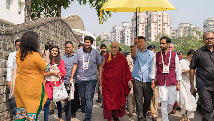 His Holiness the Dalai Lama escorted by his hosts walking to lunch at the conclusion of the first day of teachings at Somaiya Campus Auditorium in Mumbai, India on December 8, 2017. Photo by Lobsang Tsering