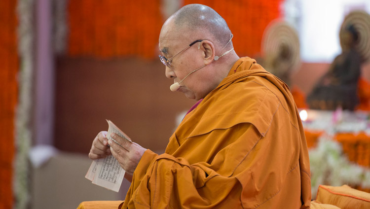 His Holiness the Dalai Lama reading from the text on the second day of his teachings at Somaiya Vidyavihar Campus Auditorium in Mumbai, India on December 9, 2017. Photo by Lobsang Tsering