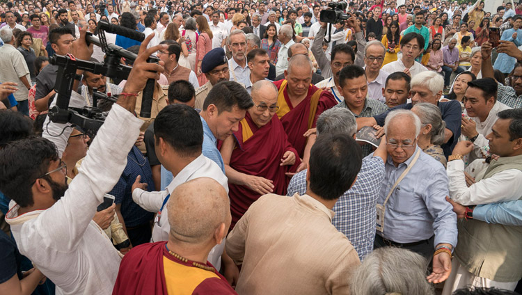 His Holiness the Dalai Lama making his way through the crowd of over 2000 on his way to the dias to begin his talk at Somaiya Vidyavihar in Mumbai, India on December 10, 2017. Photo by Lobsang Tsering His Holiness the Dalai Lama making his way through the crowd of over 2000 on his way to the dias to begin his talk at Somaiya Vidyavihar in Mumbai, India on December 10, 2017. Photo by Lobsang Tsering