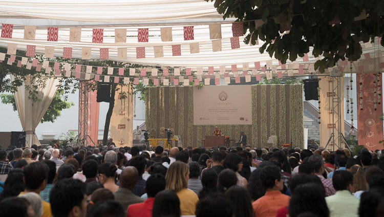 Members of the audience listening to His Holiness the Dalai Lama speaking at ccA view of the stage set up under a large awning, venue for His Holiness the Dalai Lama's talk at Somaiya Vidyavihar in Mumbai, India on December 10, 2017. Photo by Lobsang Tsering