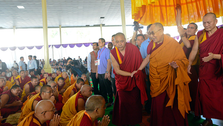 His Holiness the Dalai Lama greeting members of the crowd as he arrives at the Drepung Loseling debate ground in Mundgod, Karnataka, India on December 12, 2017. Photo by Lobsang Tsering
