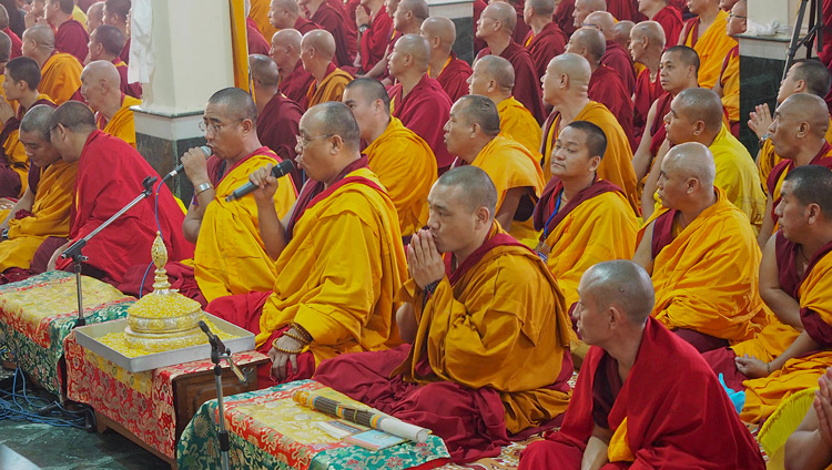 The Chant Master leading prayers as His Holiness the Dalai Lama arrives at the Ganden Lachi Assembly Hall in Mundgod, Karnataka, India on December 17, 2017. Photo by Jeremy Russell