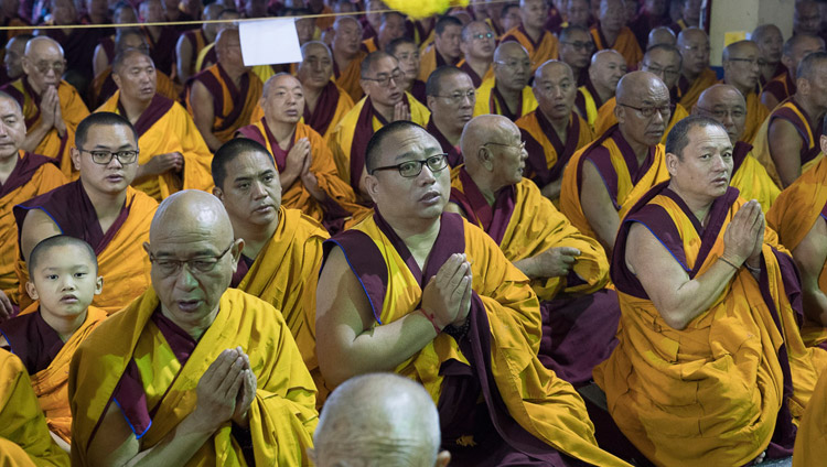 Members of the more that 15000 strong crowd watching as His Holiness the Dalai Lama performs preparatory rituals and procedures for the Hayagriva Empowerment he was going to give at Sera Jey Monastery's debate courtyard in Bylakuppe, Karnataka, India on December 20, 2017. Photo by Lobsang Tsering