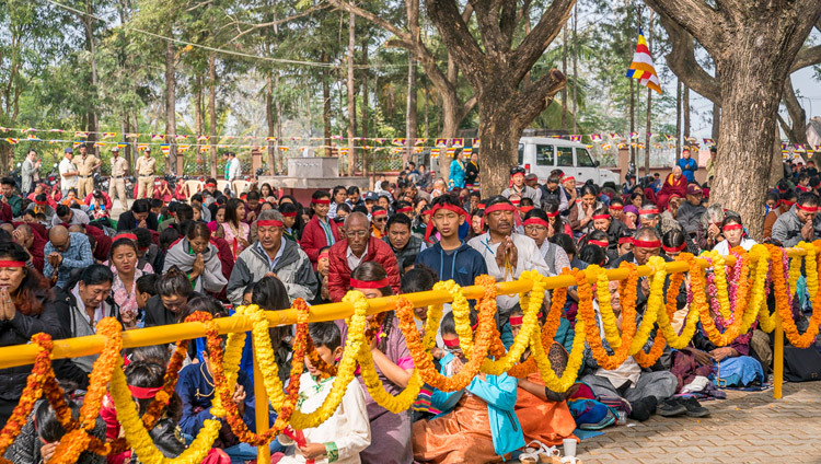 Lay members of the Tibetan community among the crowd of over 15,000 wearing ritual blindfolds during the Hayagriva Empowerment bestowed by His Holiness the Dalai lama at Sera Jey Monastery's debate courtyard in Bylakuppe, Karnataka, India on December 20, 2017. Photo by Lobsang Tsering