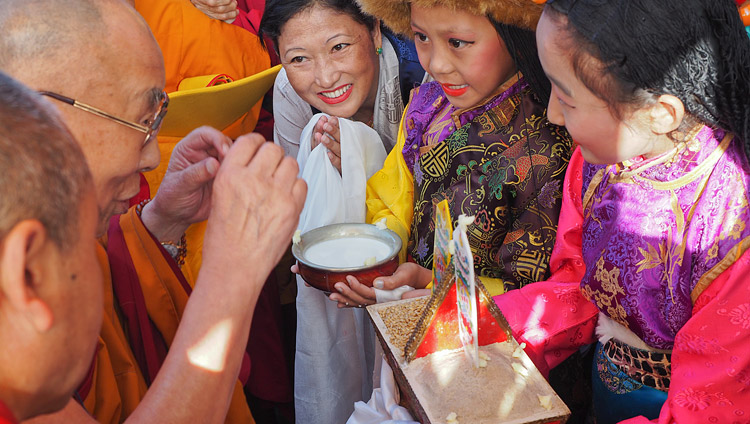 Tibetan children in traditional dress offering His Holiness the Dalai Lama a traditional welcome on his arrival at Sera Mey Monastery in Bylakuppe, Karnataka, India on December 21, 2017. Photo by Jeremy Russell