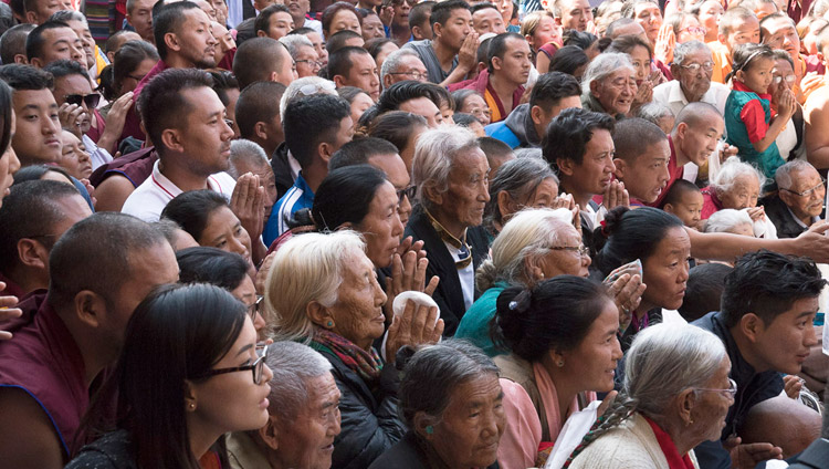 Members of the Tibetan community watching His Holiness the Dalai Lama depart at the conclusion of the inauguration of the new Sera Mey Monastery debate courtyard in Bylakuppe, Karnataka, India on December 21, 2017. Photo by Lobsang Tsering