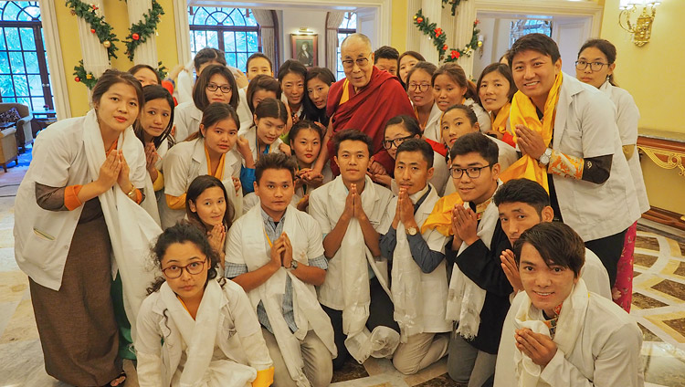 His Holiness the Dalai Lama with group of 25 Tibetan youths who help Tibetan patients who come from the Tibetan settlements for treatment in Bengaluru after their meeting in Bengaluru, Karnataka, India on December 24, 2017. Photo by Jeremy Russell